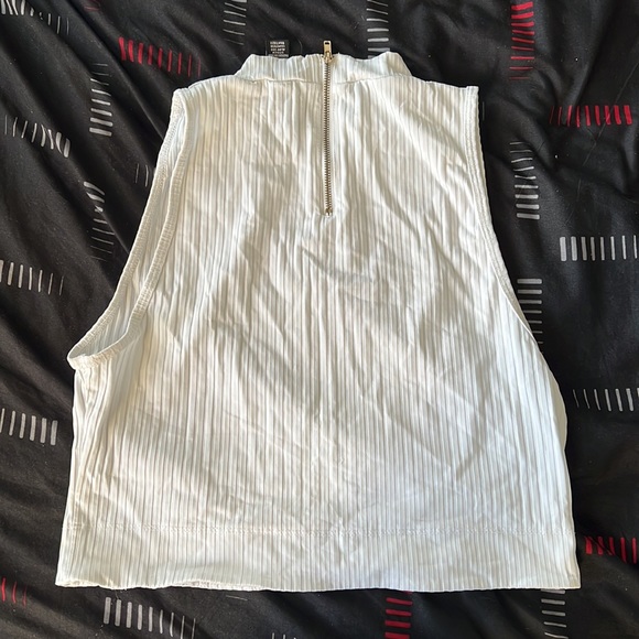This is a white cropped top with a zipper back - Picture 2 of 2
